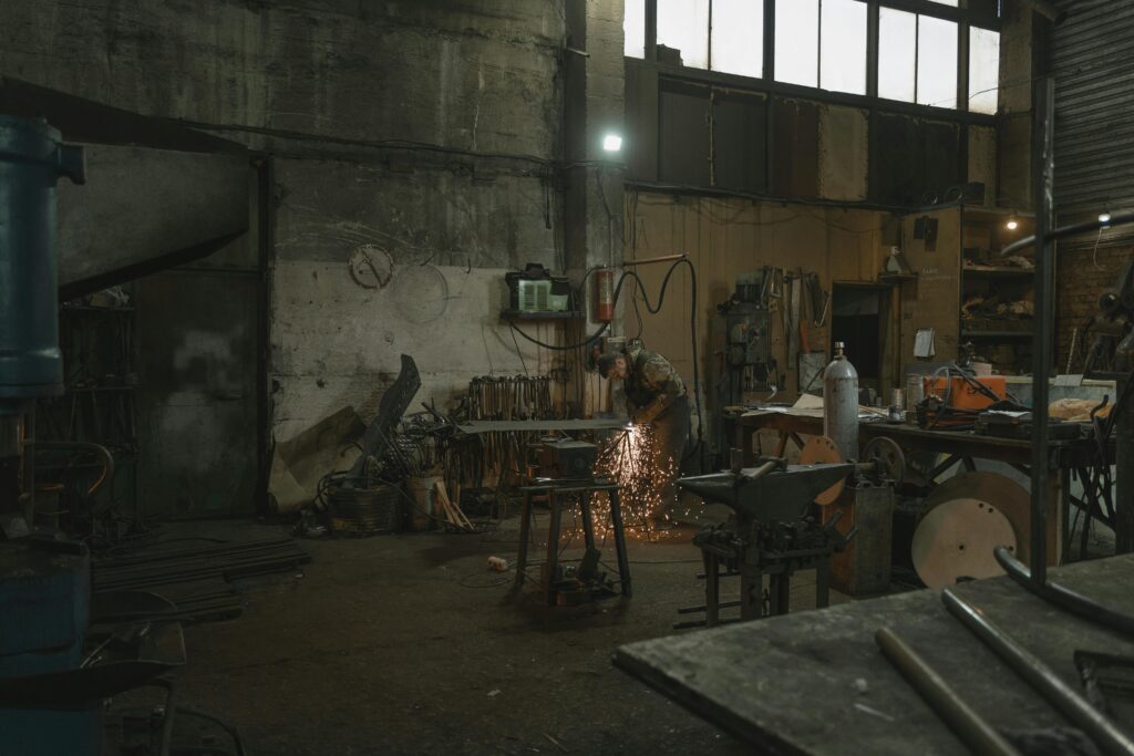 man welding in workshop